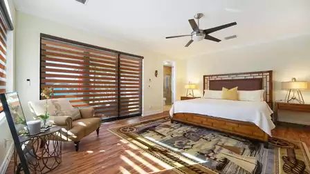 The second bedroom also offers access to the pool area