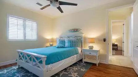 A Queen size bed can be found in the fourth bedroom