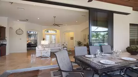 Generous sliding doors that connect the living room with the terrace and enable seamless indoor/outdoor living