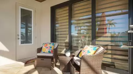 Outside, you will find a charming seating area consisting of two armchairs and a matching table