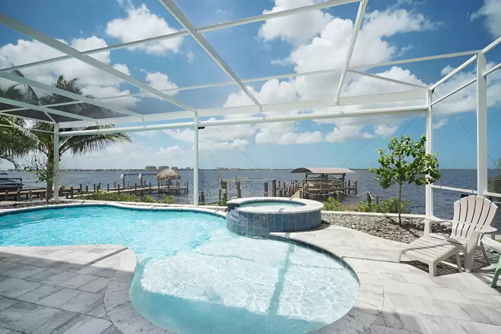 The paved pool area includes pool and spa