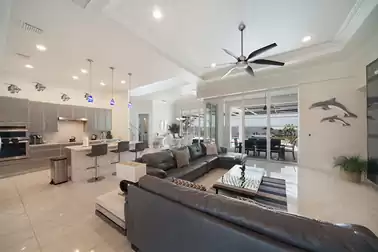Living room, kitchen and dining room are connected in an open floor plan