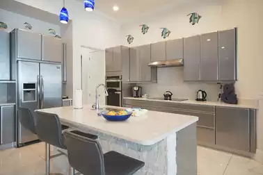 The kitchen is held in a cool gray
