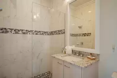 Bathroom #5 is equipped with a walk-in shower