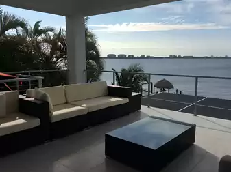 Inviting sitting area on the covered upper floor patio