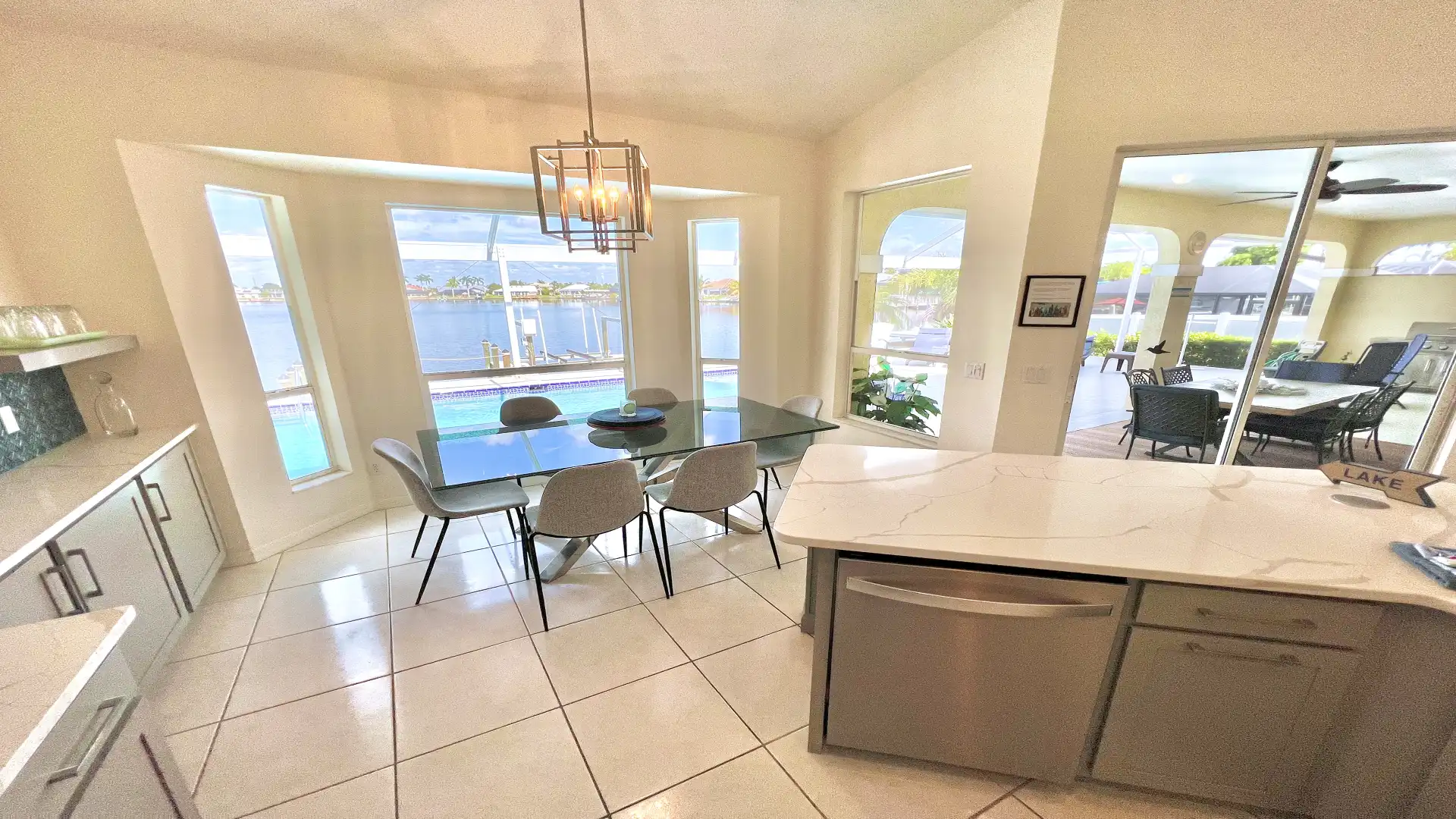 The dining area has a glass dining table and space for six people