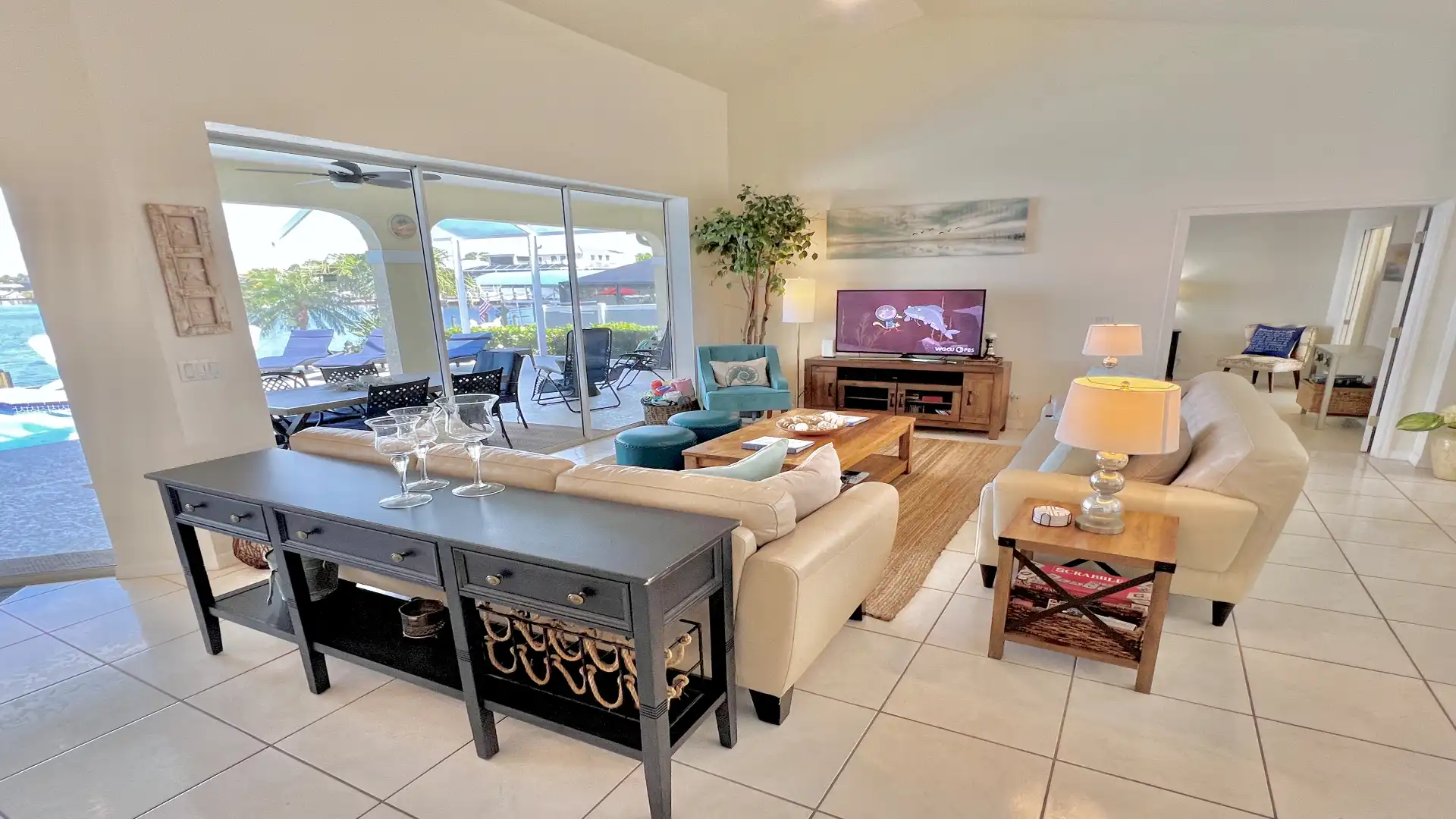 The open-plan living area is flooded with light thanks to the floor-to-ceiling windows