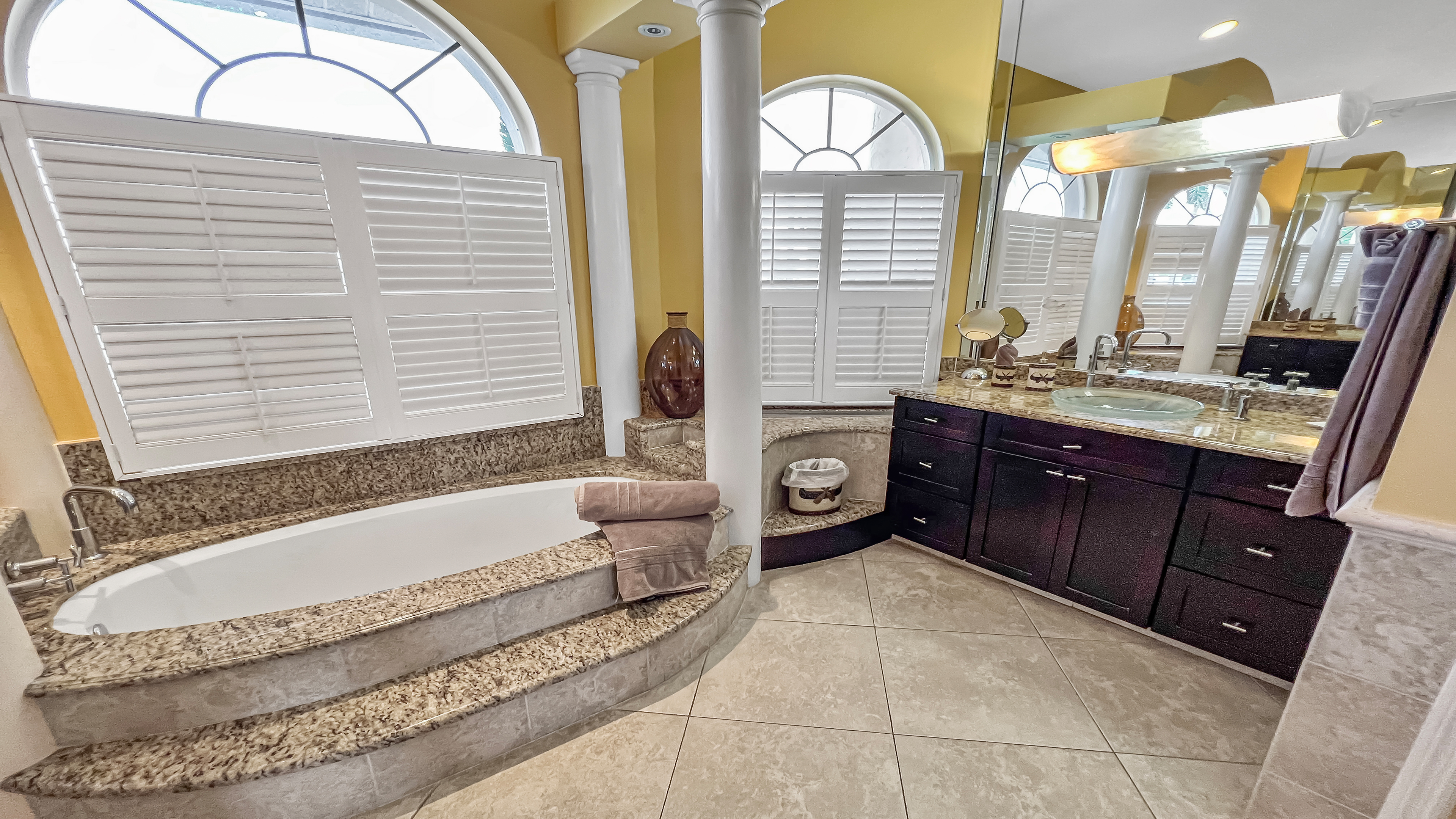 Bath tub surrounded by columns