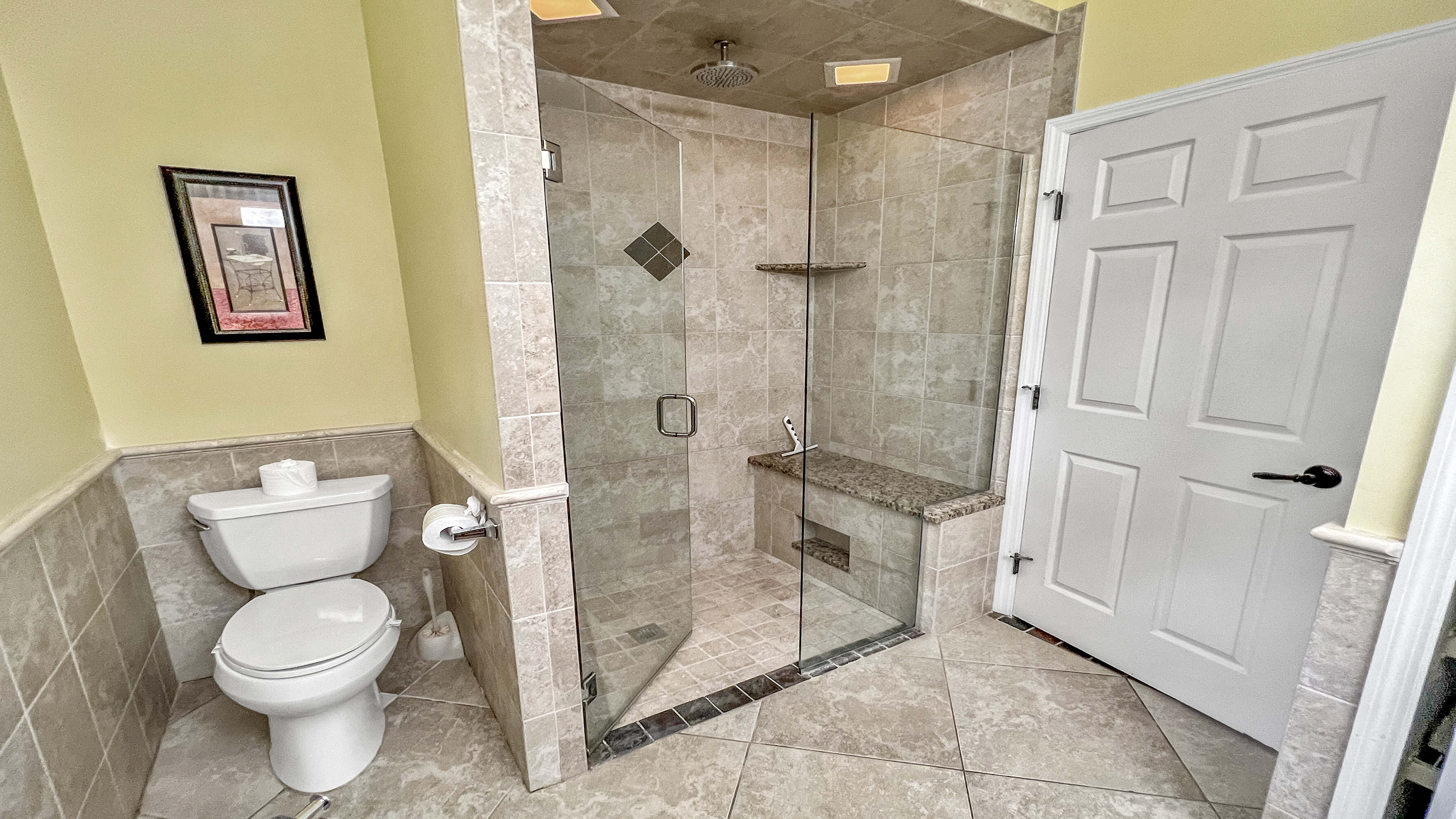 Large shower cabin with rain shower in the guest bathroom