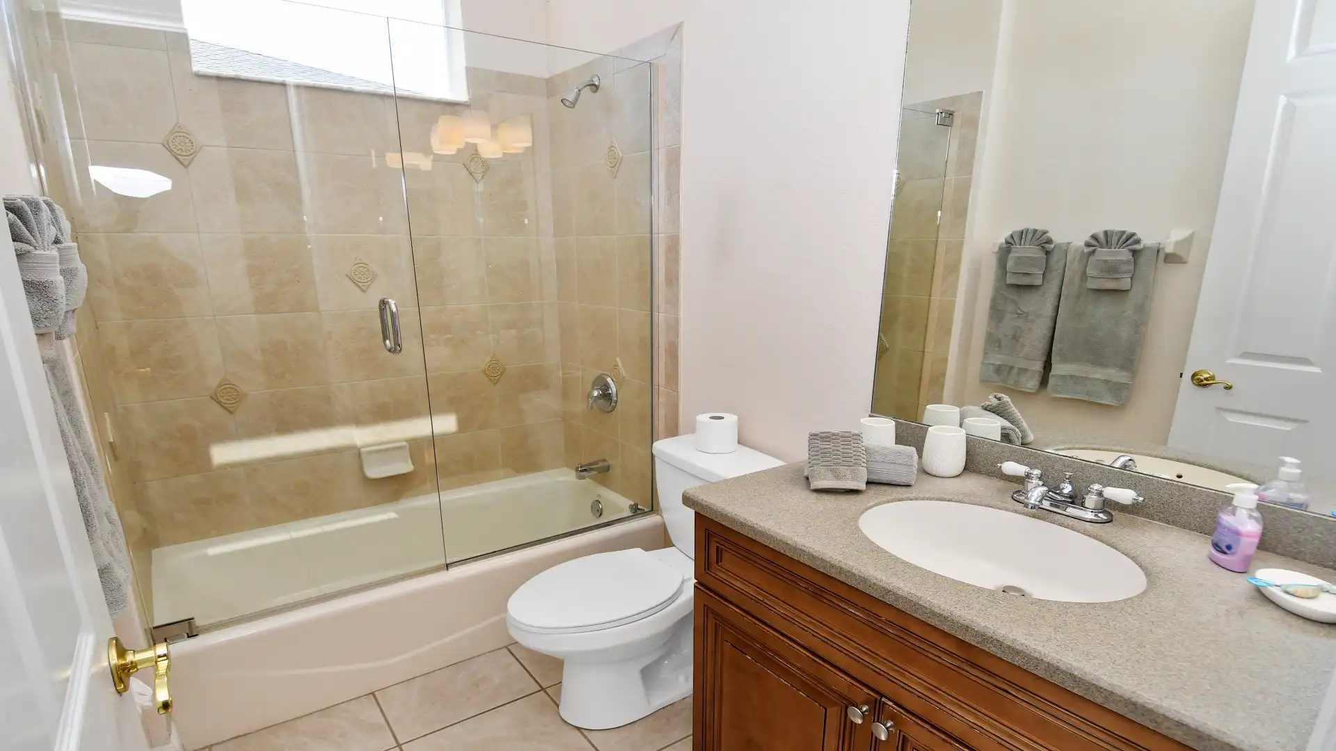 The guest bathroom has a bathtub/shower combination