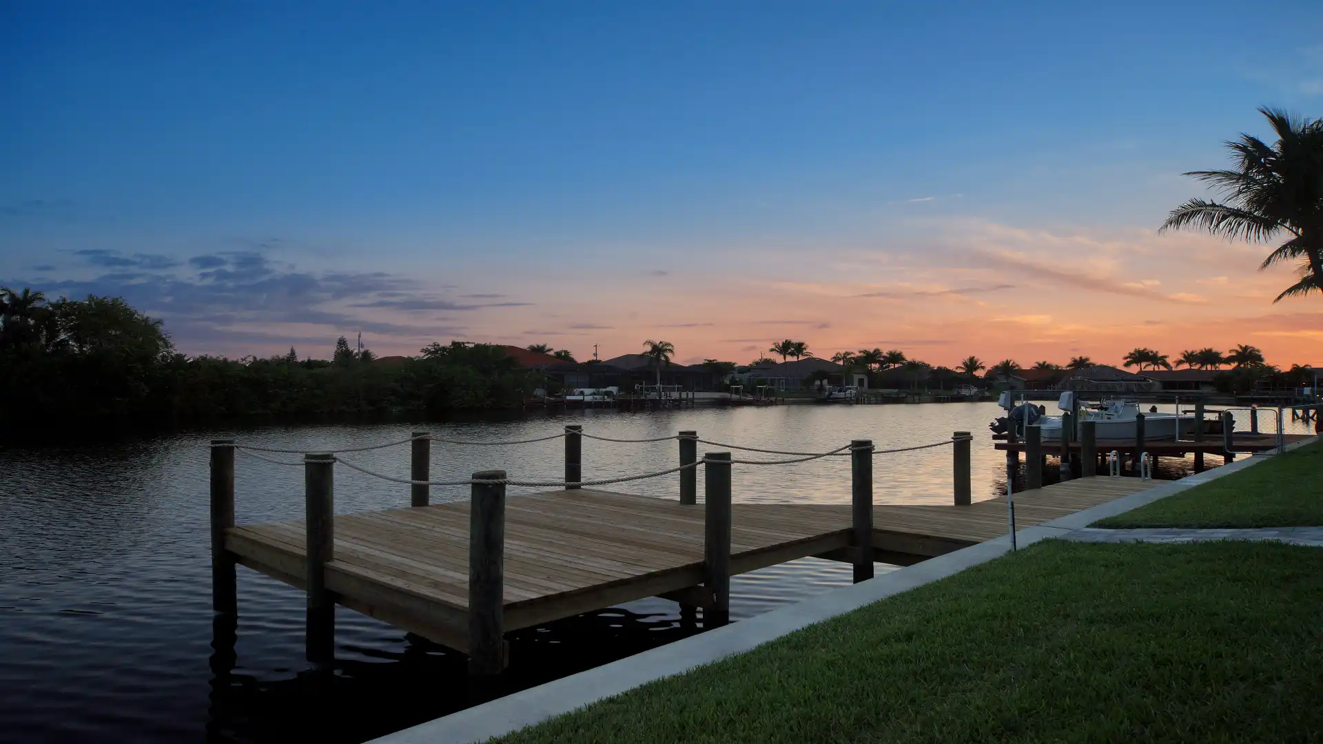 Sunset over the canal, romantic view from Villa Elvenar’s private dock.
