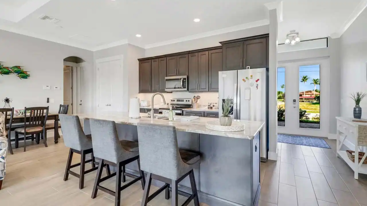 The kitchen welcomes you with an ultra-modern counter for 3 people