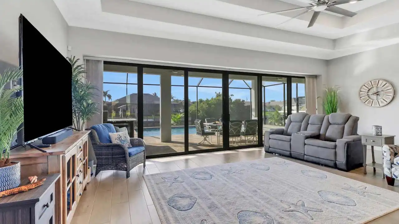 The floor-to-ceiling windows allow plenty of sun and light into the room