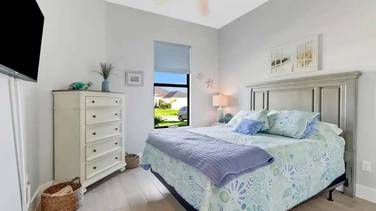 The second bedroom not only boasts a great view of the well-kept driveway, but also a...
