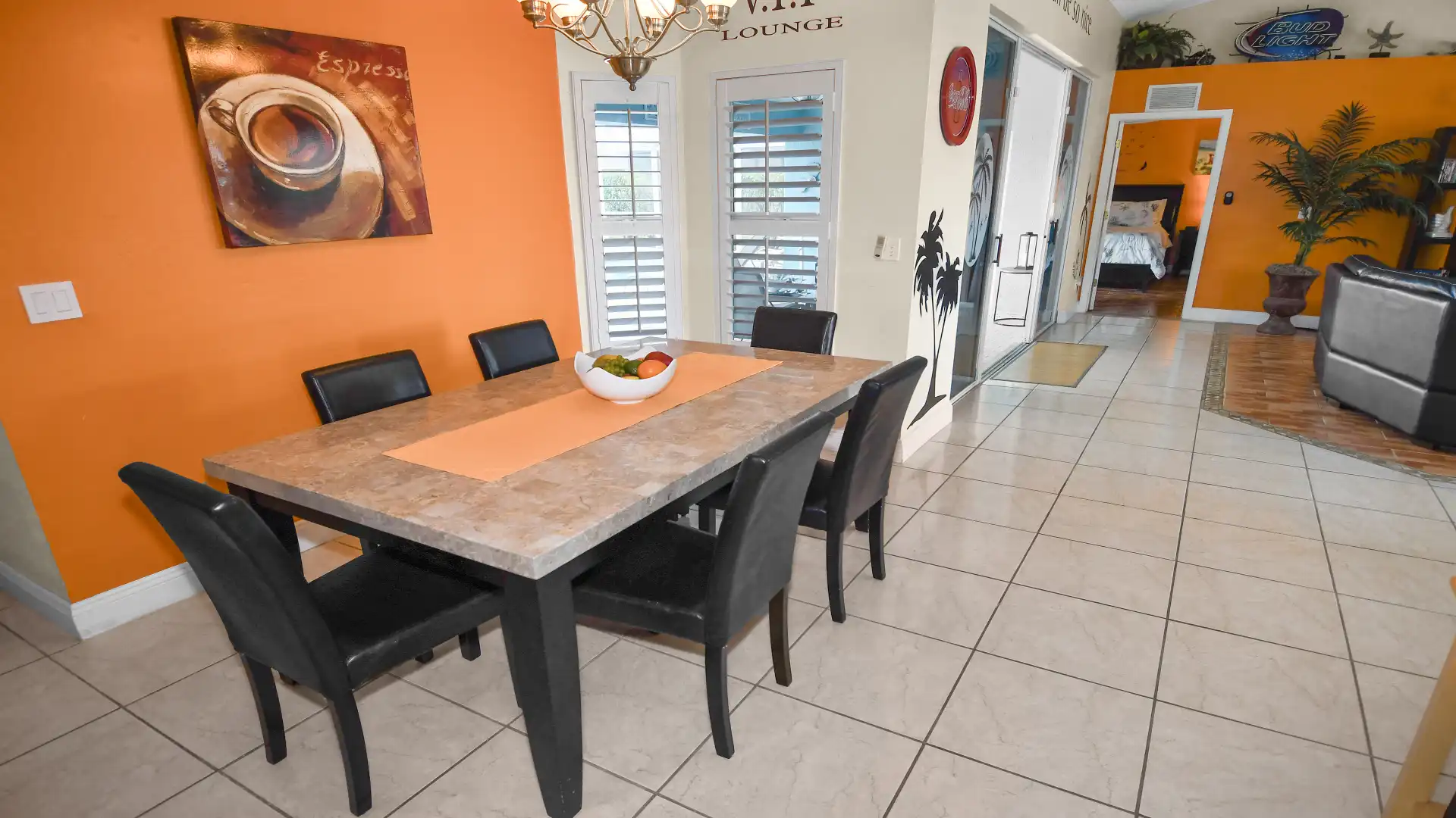 The dining area features a stylish dining table with space for six people