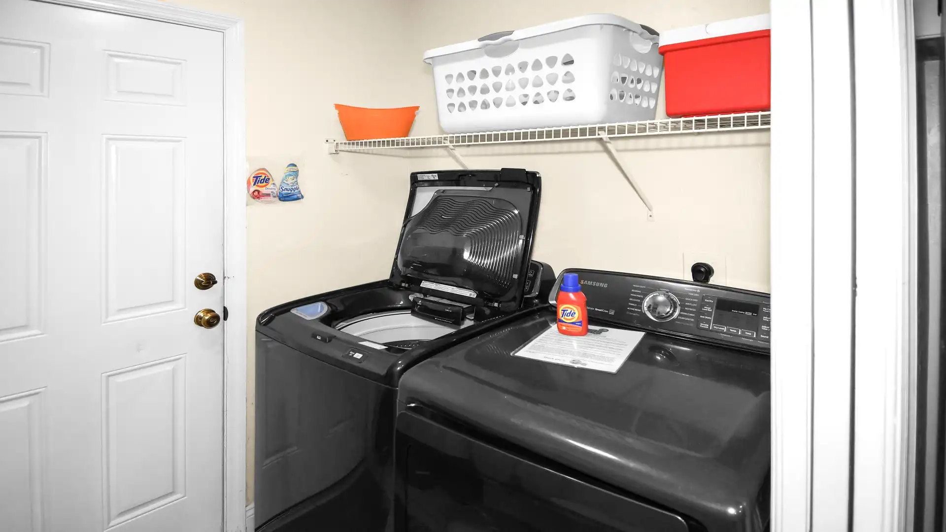 The laundry room features state-of-the-art household appliances