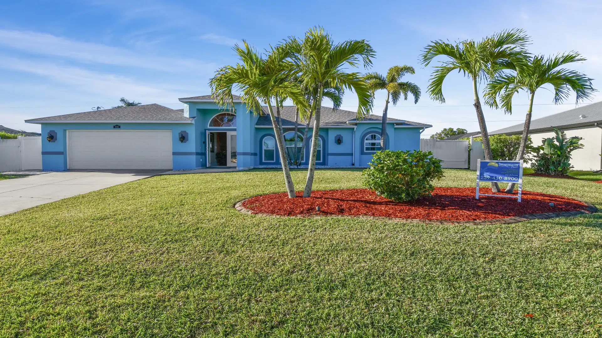 The well-tended garden surrounds the entire house