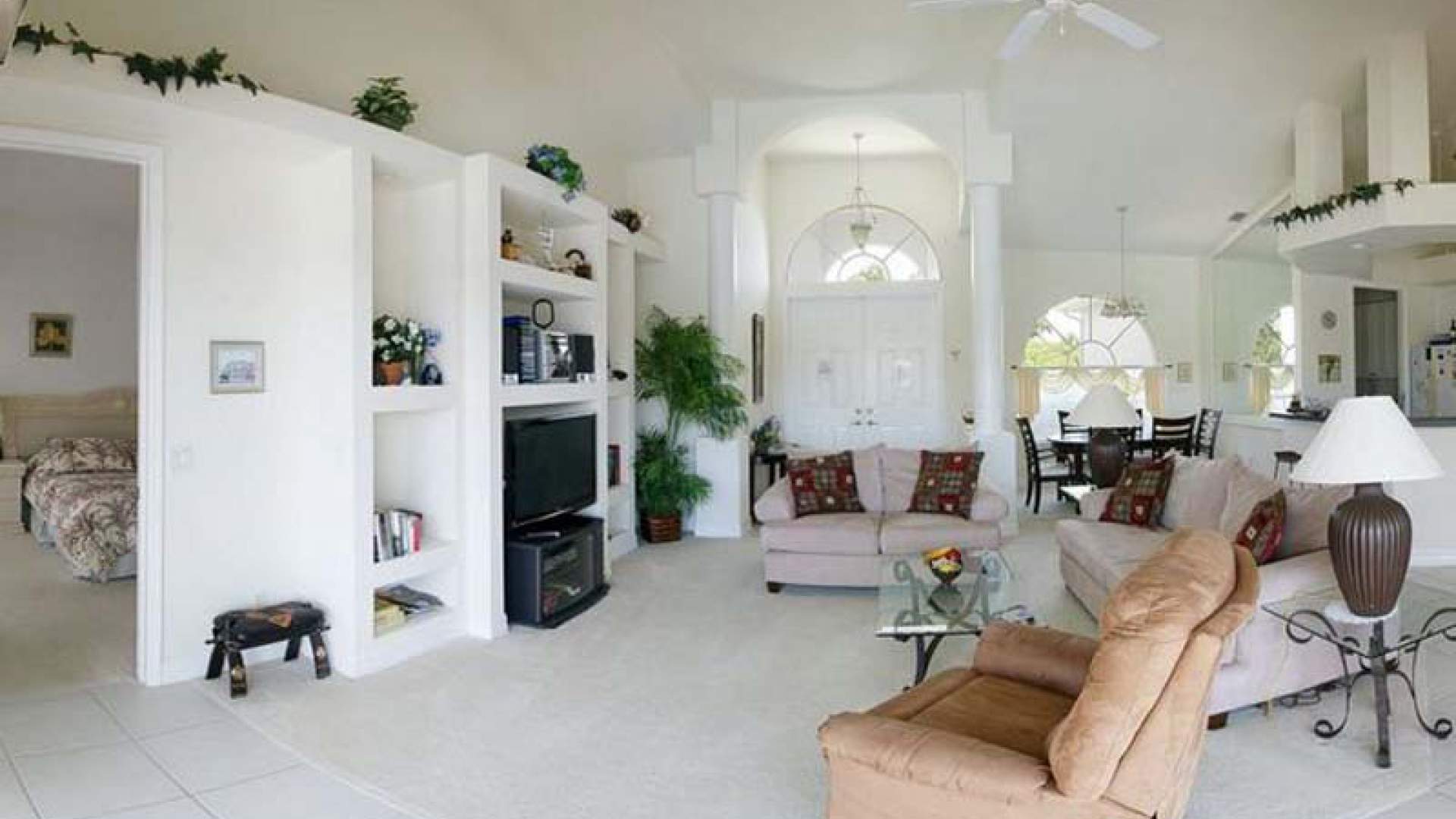 The spacious living room offers comfortable seating for six