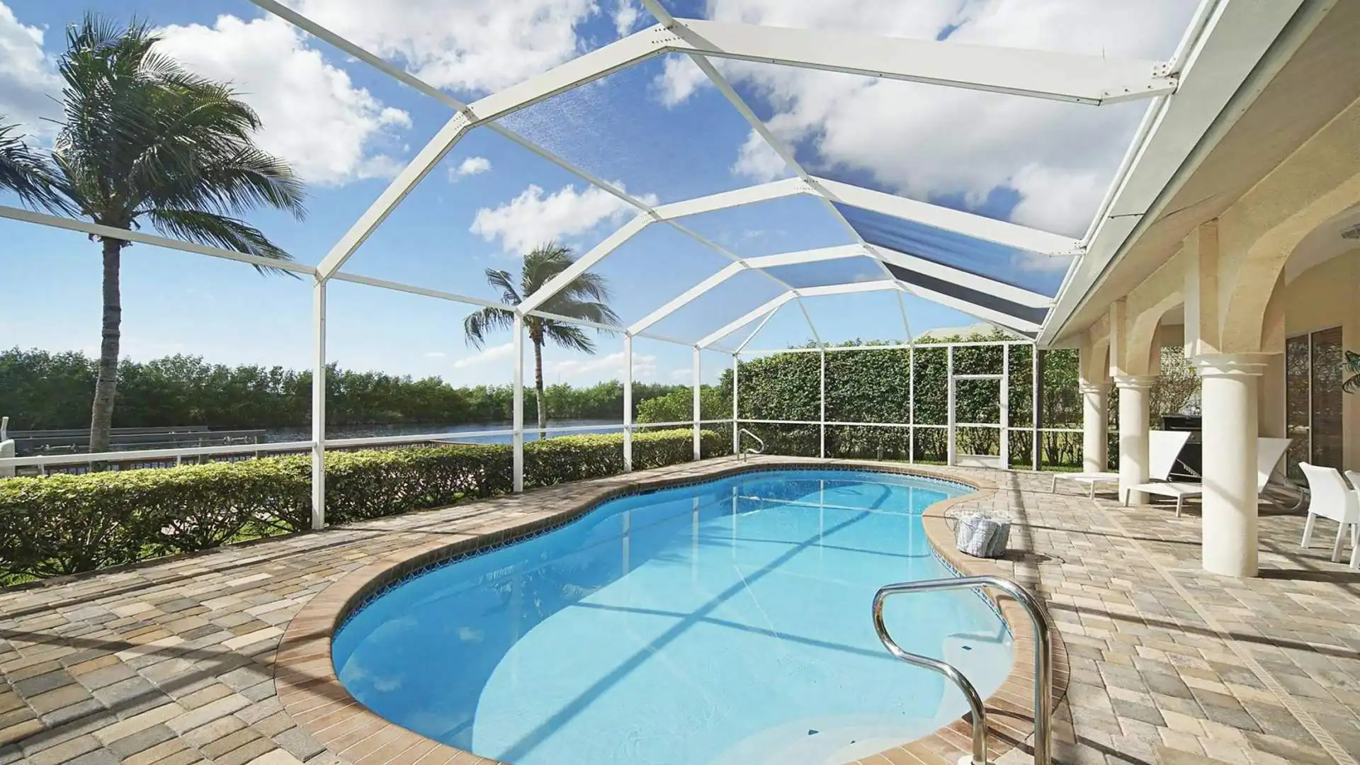 The large kidney-shaped pool is electric heated