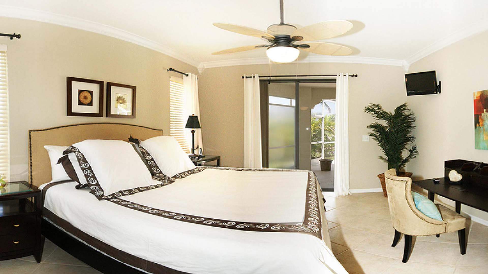 This beautiful bedroom offers a King size bed and access to the patio