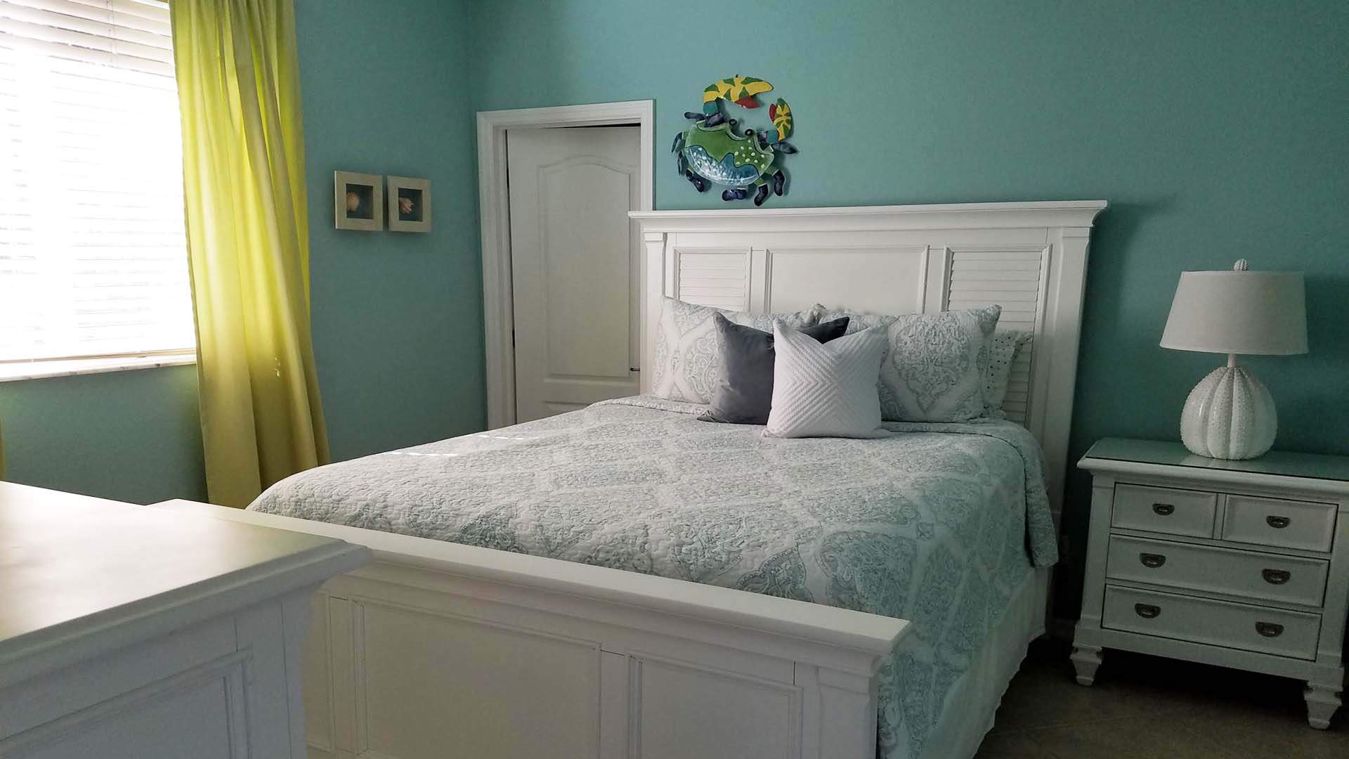 A Queen size bed is available in the third bedroom