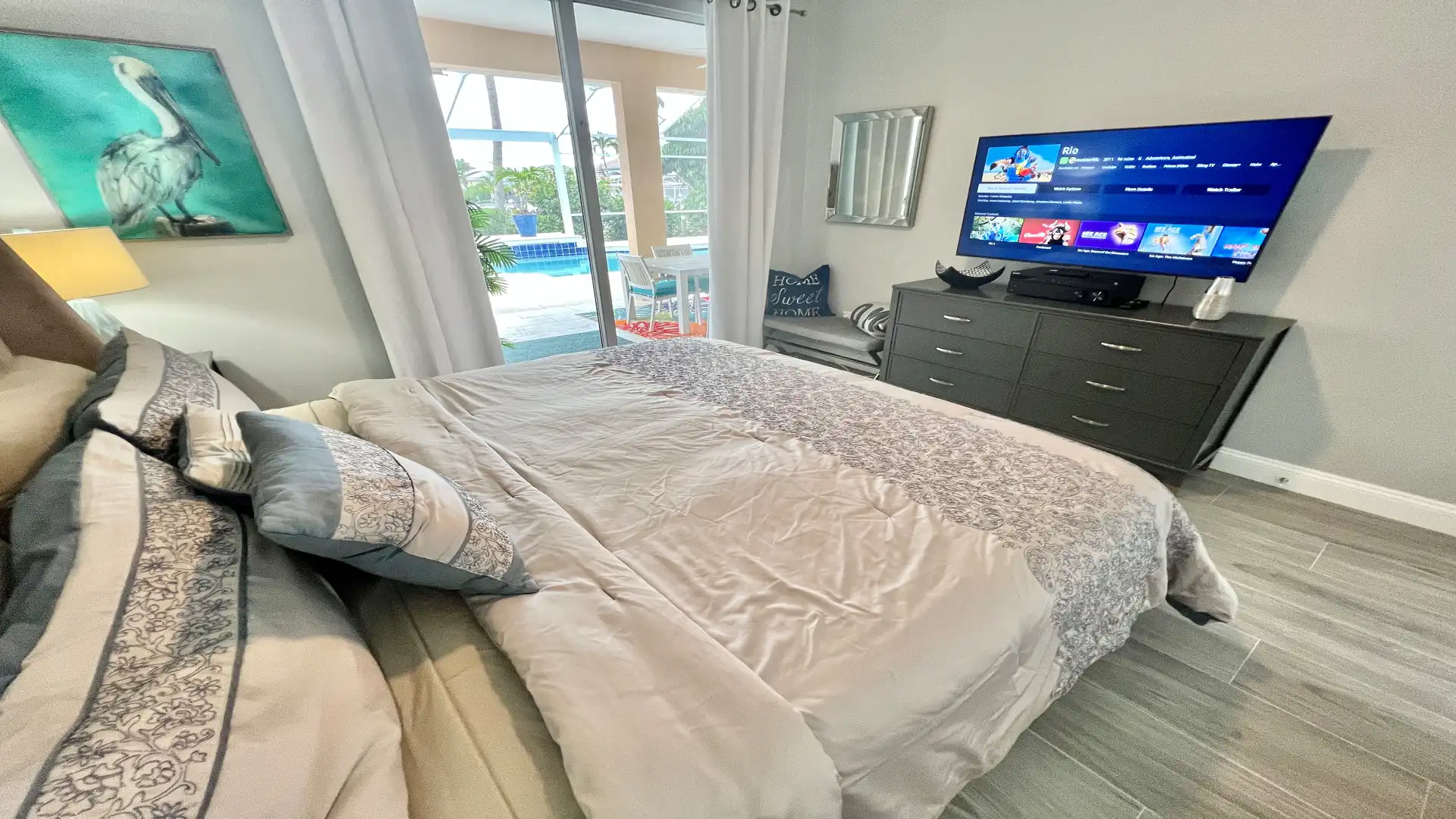 This bedrooms offers access to the pool area as well