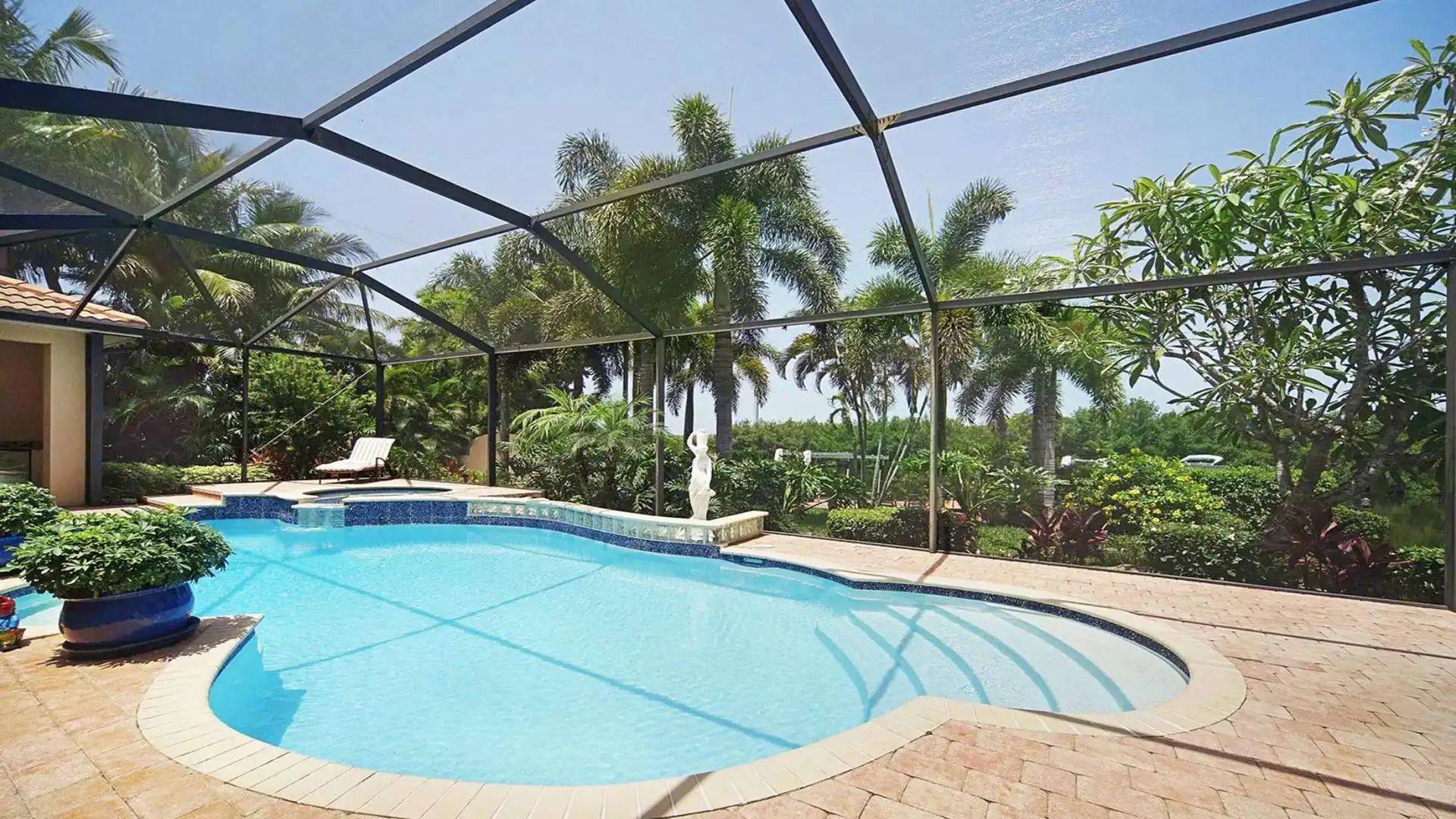 The crystal clear pool in the middle of a green oasis