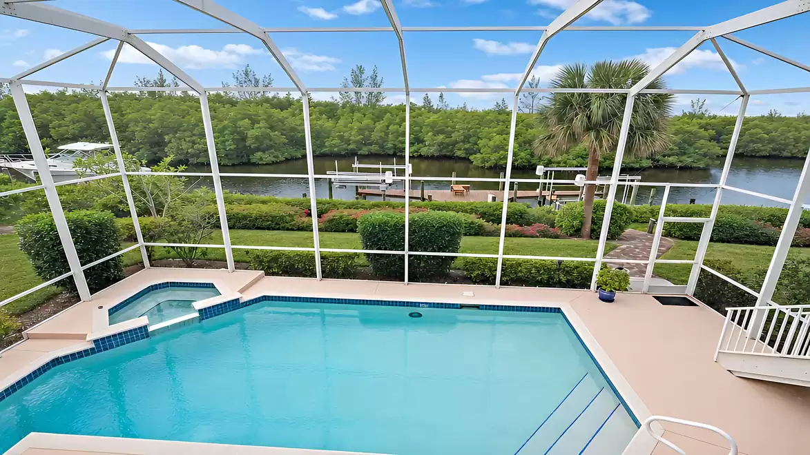 View from the balcony of the pool and sailboat canal