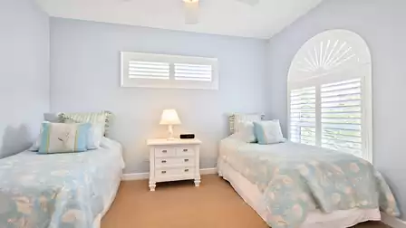 This bedroom offers two comfortable Twin beds