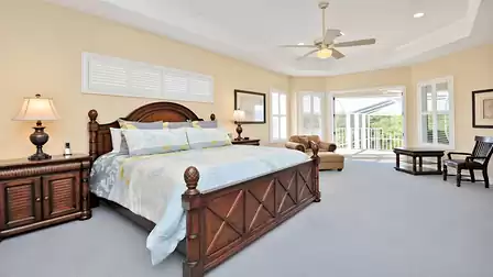 French doors lead from the master bedroom to the balcony