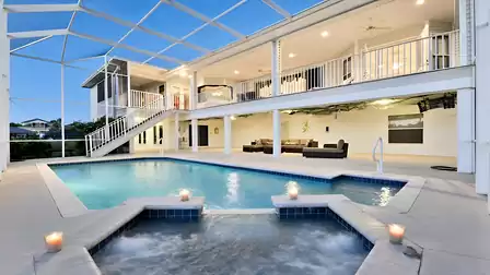 The huge pool area is protected by a two-story cage
