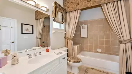 This attractive bathroom features a tub
