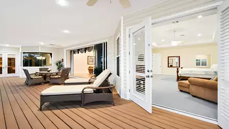 The huge balcony extends along the back of the home