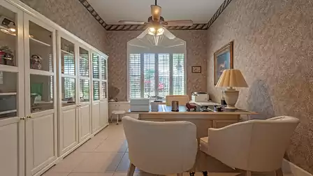 the office is bright and inviting with white coloured furniture