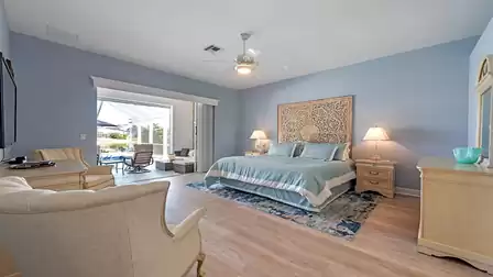 The elegantly furnished master bedroom offers an king size bed 