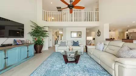Living room with comfortable sofa, TV and access to the terrace