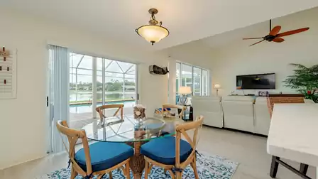 Dinning area with view to the white kitchen