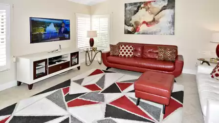Second living room with modern leather seating and TV